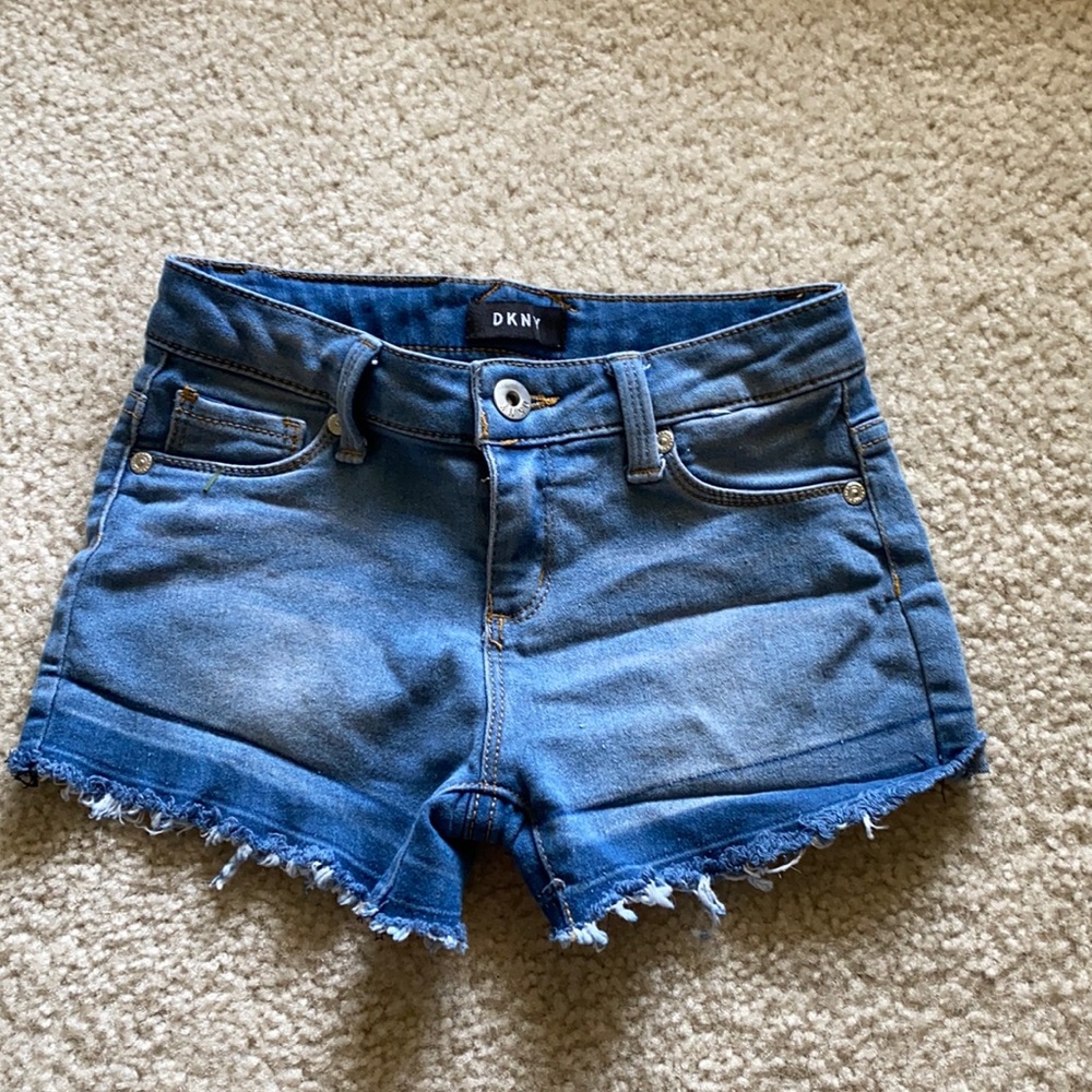 Cute girls denim shorts with frayed bottoms